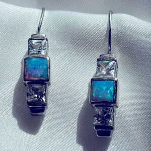 Silver (925) earrings with blue stone and faux diamonds.